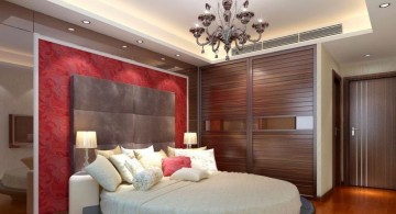 sleek tray ceiling bedroom with intage chandelier