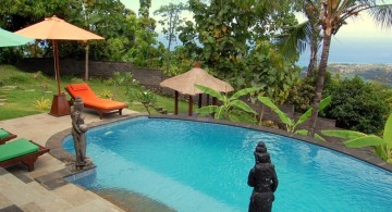 small kidney shaped swimming pools on the hill