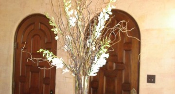 tall vase with branches as center piece