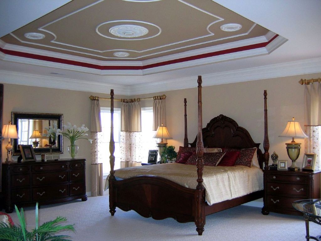 tray ceiling bedroom with four posts bed