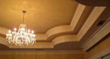 tray ceiling bedroom with spider chandelier