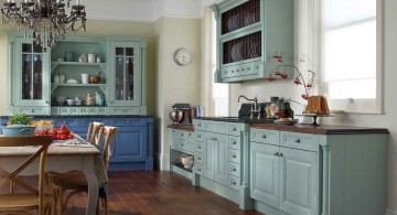 vintage and retro kitchen design with wooden floor and green cabinets