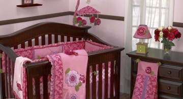 pink baby room ideas with wall art and wooden theme