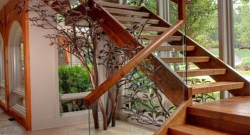 wooden stairs with clear glass railing