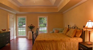 yellow toned tray ceiling bedroom