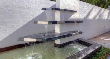 Great image of modern water feature design using tiered glass fountain