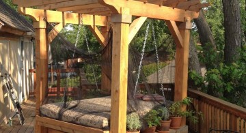 Outdoor swinging beds under the tree