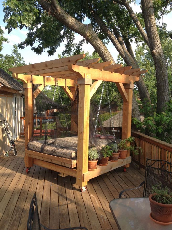 Outdoor swinging beds under the tree