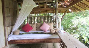 Outdoor swinging beds with a fan