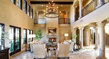 Tuscan living room decor with tall ceiling and chandelier