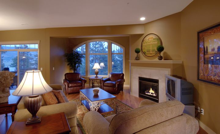 Tuscan living room decor with white fireplace