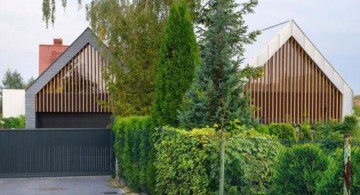 Two Barn House entrance wide view by RS+ Architecture, Poland