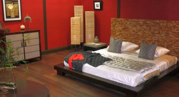 asian inspired bedroom with red walls and wooden floor