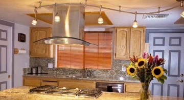 bright and lovely track lighting idea over kitchen island with marble countertop