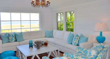 bright turquoise living room decor with lovely chandelier