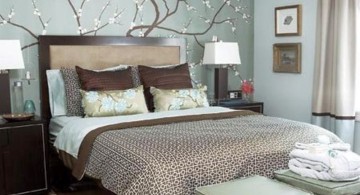 brown and blue bedroom with flower rug