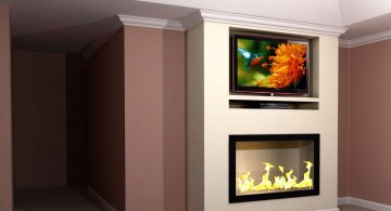 built in TV above fireplace