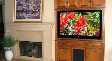 built in TV next to fireplace