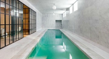 contemporary indoor lap pool with glass door