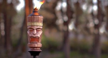 cool tiki torches featuring unique ethnic mask design