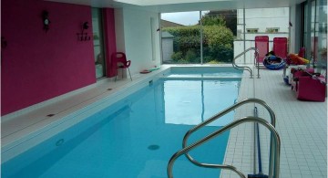 enclosed swimming pool with pink wall