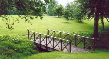 flat DIY garden bridge with steel railings