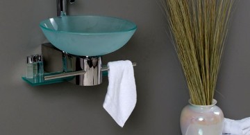 floating sinks with clear blue bowl and floor vase