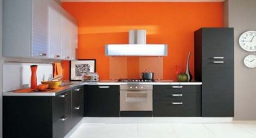 grey and black contemporary modular kitchen idea with bright and sweet orange splash