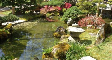 japanese garden designer with garden lamp and koi pond