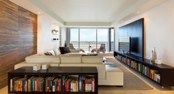 long living room with bookshelves