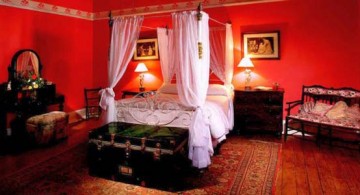 luxurious hot red bedroom ideas with canopy bed and decorative treasure box