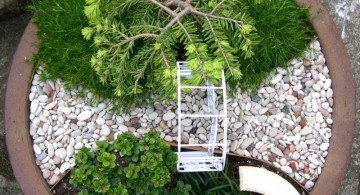 mini japanese garden with an arch gate