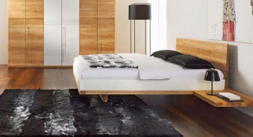 minimalist modern floating bed coupled with nice wooden floor and gorgeous black rug