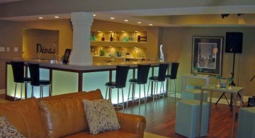 modern basement with a small bar