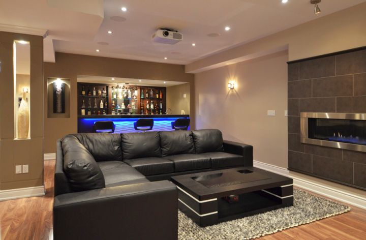 modern basement with sleek black sofa