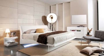 modern floating bed with large floor lamp