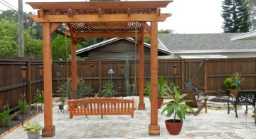 modern pergola kit with a swing