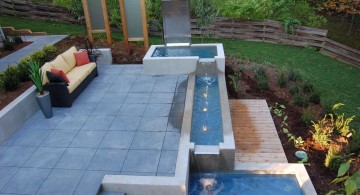 modern water features tiered on stone deck