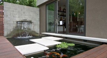 modern water features with stone pathway on a pond