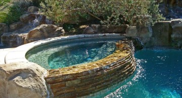 pool waterfall ideas with rustic stone wall