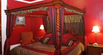red bedroom walls with canopied bed