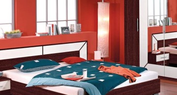 red bedroom walls with wooden floor