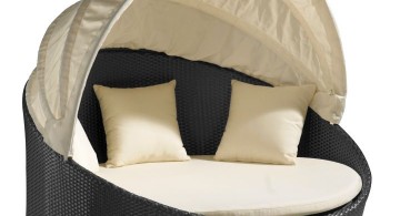 round bed frame in monochrome with fold in canopy