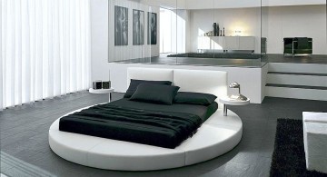 round bed frame with normal mattress in monochrome