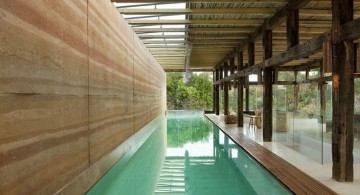 semi indoor lap pool with wooden deck