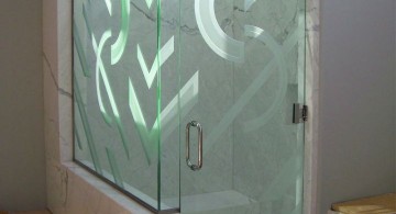 textured modern glass shower on marble walls