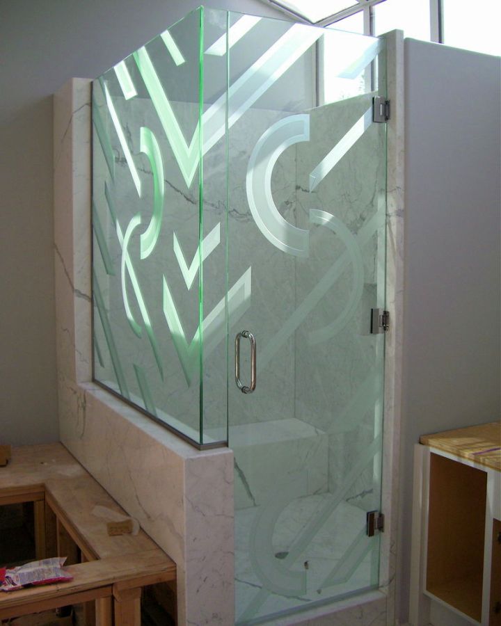 textured modern glass shower on marble walls