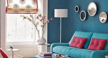 turquoise living room decor with pink cushions