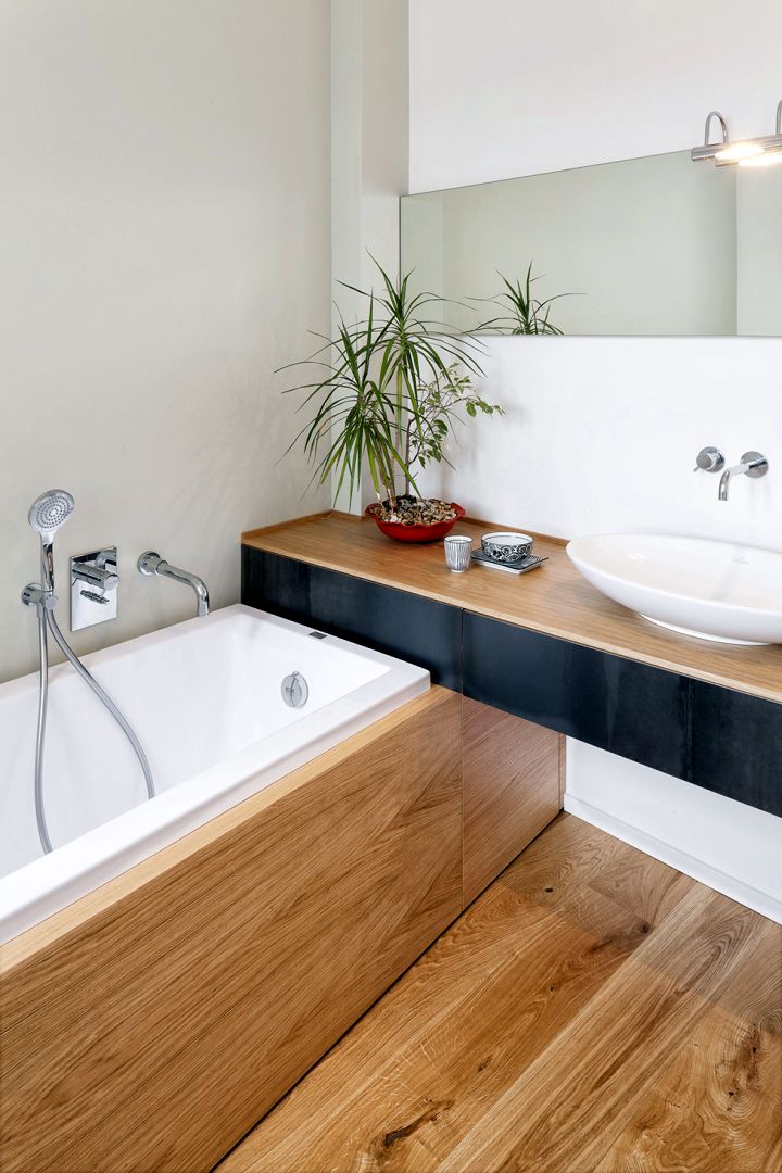 wood bathroom with in ground tub