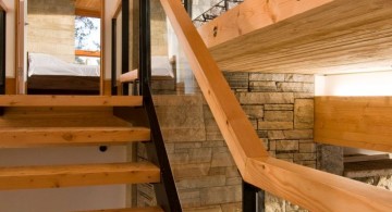 wood staircase with patterned glass railing